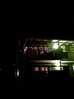 Och från vår balkong lyser både adventsljusstake och tingeltangel-ljus ;-)